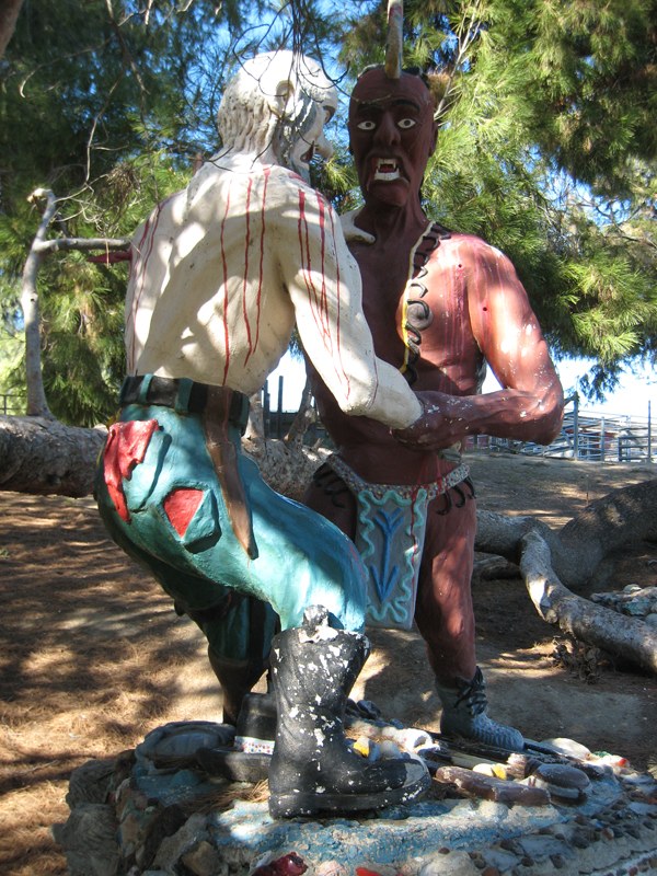 Peg Leg Smith and Big Bear are in battle in this life size cement sculpture.
